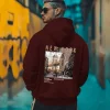 Back Printed Maroon Essential Hoodie with premium cotton fleece fabric, oversized fit, stylish graphic back print, kangaroo pocket, adjustable hood, and ribbed cuffs on a clean white background.