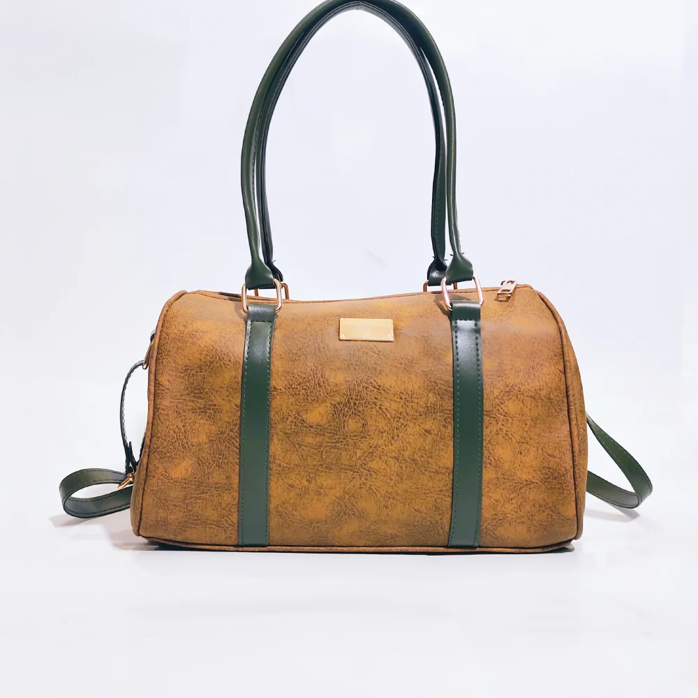 Elegant genuine leather women's handbag in brown with premium craftsmanship, spacious compartments, adjustable shoulder strap, and modern stylish design.