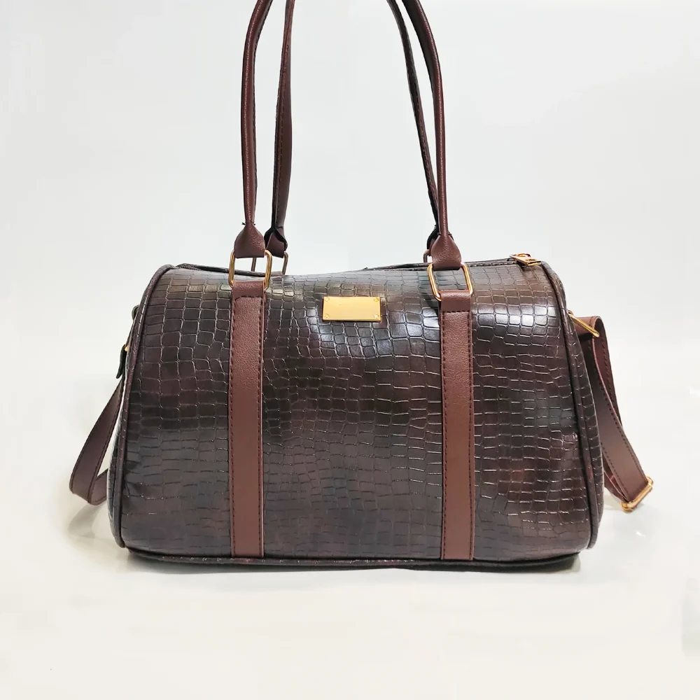 Elegant genuine leather women's handbag in brown with premium craftsmanship, spacious compartments, adjustable shoulder strap, and modern stylish design.